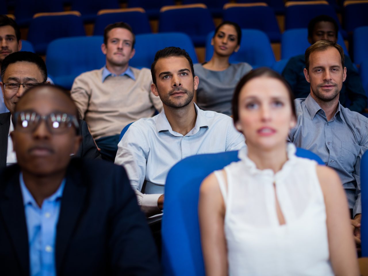 Business executives participating in a business meeting at conference center