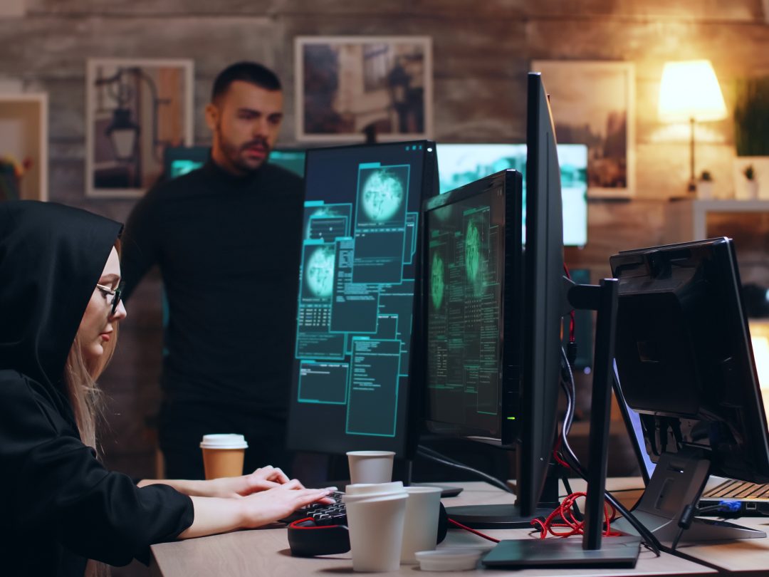 Girl hacker wearing glasses and a hoodie