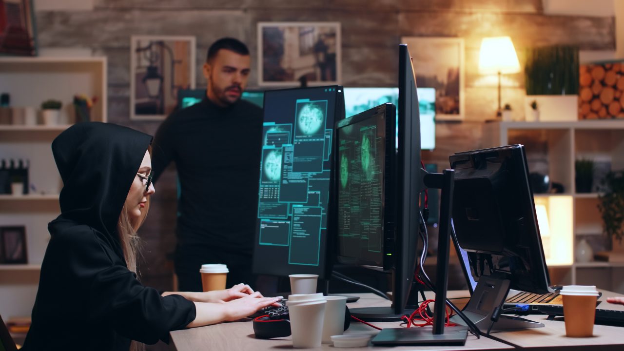 Girl hacker wearing glasses and a hoodie